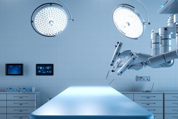 A modern, sterile surgical room equipped with advanced robotic surgery tools, bright overhead lights, and digital monitors displaying data.