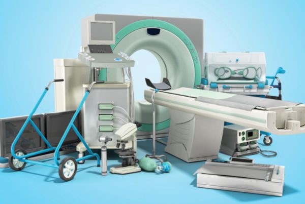 A collection of medical equipment including an MRI machine, ultrasound device, incubator, hospital bed, and other diagnostic tools arranged against a light blue background.