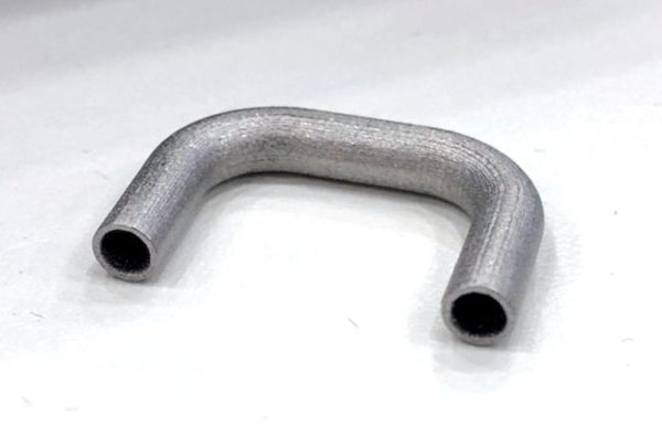 Metal pipe bent into a u-shape, displayed on a plain white background.