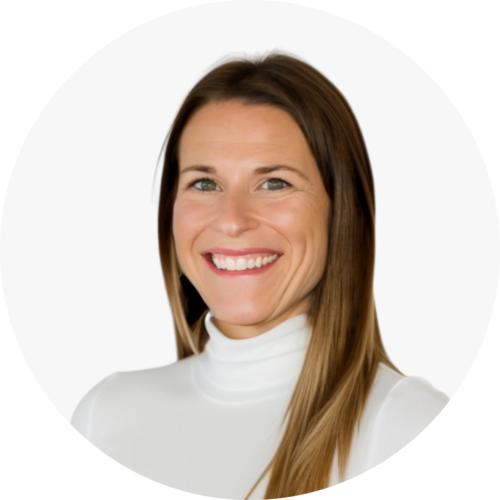 A woman with long brown hair wearing a white turtleneck smiles at the camera against a white background, subtly reflecting the innovative world of metal 3D printed parts.