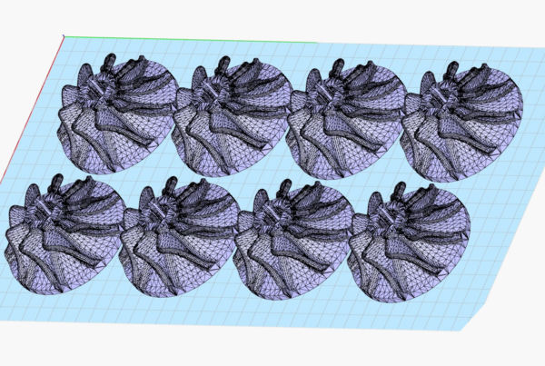 3D rendering of eight identical mesh apple models, optimized through design for additive manufacturing, arranged in a grid pattern on a light blue grid background.